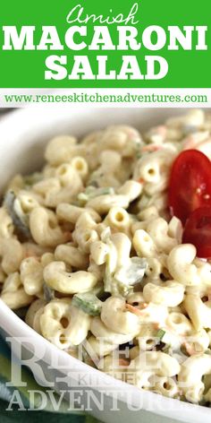 macaroni salad in a white bowl with a red cherry on top and text overlay