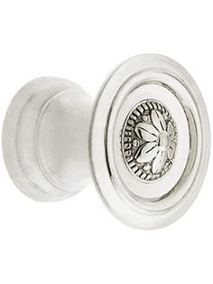 an image of a door knob with a flower design on the front and bottom part