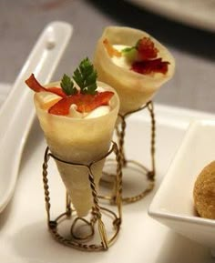 two small desserts are sitting on a tray