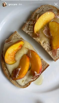 two pieces of bread with peaches and peanut butter on them sitting on a white plate