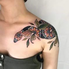 a woman with a tattoo on her shoulder