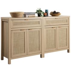 a sideboard with wicker doors and baskets on top, against a white background