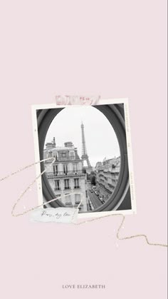 the eiffel tower is seen through a round window