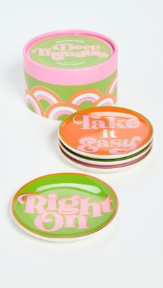 three round tins with the words right on in pink, green and orange designs