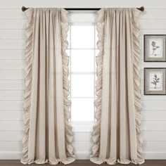 the curtains in this room have ruffles on them and are ready to be hung