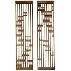 a pair of wooden doors with lattices on them