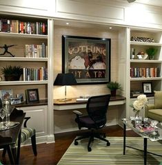 a living room filled with furniture and bookshelves next to a wall mounted book shelf