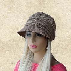 This fabric cap is very warm and suitable for the winter days and any time you want to add a plus of elegance and a flattering touch to your outfit.  It has a It is padded for warmth.  This is an excellent fashion accessory,  and it can match with many outfits.  It's lightweight, comfy, and stylish. Also it's foldable hat (great for traveling). Adjustable size fits an average women's head.  Hand washable; please lay flat to dry. NOTE Actual color may slightly different depending on your monitor. Beige Visor Hat For Fall, One Size Fits Most Cloche Hat For Outdoor, Slouchy Beanie Bonnet, Wide Brim Cloche Hat, One Size Beige Bonnet, Beige One Size Fits Most Bonnet, One Size Fits Most Beige Bonnet, Beige Visor Hat For Winter, Beige Winter Visor Hat