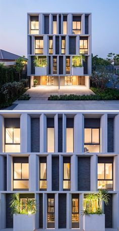 an apartment building with many windows and plants on the top floor is lit up at night