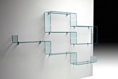 glass shelves on the wall in an empty room