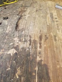 an old wooden floor with some tools on it