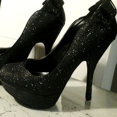 New Pair Of Shoes By Night Moves Black Glitter Sparkle Fabric Upper Trimmed In Fx Patent Leather Covered 5.25 In. Heel With 1.5 In. Toe Platform Accent Double Bow At Heel Rounded Toe Gold Padded Insole Treaded No Slip Toes On Outer Sole Black Platform Heels For Prom, Black Pointed Toe Heels With Glitter Accents, Black High Heels With Glitter Accents, Black Glitter Pointed Toe Heels, Black Sparkling Heels For Night Out, Sparkling Black Heels For Night Out, Black Sparkling Open Toe Heels, Glitter Heels Fitted For Night Out, Glitter Heels For Night Out