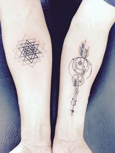 two people with matching tattoos on their arms, one has an arrow and the other has a compass