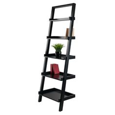 The slanted silhouette of the Bellamy shelf offers space-saving storage and display space. A 5 tiered shelf great for books, photos or collectibles and is ideal for apartment living or smaller rooms. Constructed of solid and composite wood in black. Assembly is require and includes a tip resistant kit. Winsome Wood Bellamy Black Wood 5-Shelf Ladder Bookcase (22.99-in W x 69.36-in H x 14.8-in D) | 29553 Leaning Shelves, Shelves For Books, Tiered Shelves, Leaning Shelf, Displaying Books, Tiered Shelf, Shelving Racks, Ladder Shelf, Space Saving Storage