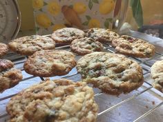 several cookies cooling on a rack next to a thermometer