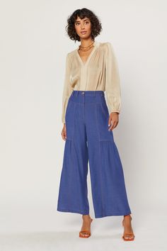 A pair of relaxed, wide-leg pants is an essential for summer dressing. This pair is the perfect addition to your warm-weather wardrobe, done in a classic indigo shade. Marigold topstitching shows off the cool details, from the angled yoke and deep porkchop pockets at the front to the workwear-inspired patch pockets at the back. Gentle shirring accentuates the easy shape. •Wide-leg silhouette •Contrast stitching •Angled yoke •Porkchop pockets •Shirred detailing •Patch pockets at back •Relaxed fit Summer Dressing, Easy Shape, Wide Leg Pant, Denim Pant, Contrast Stitch, The Cool, Denim Blue, Wide Leg Jeans, Warm Weather