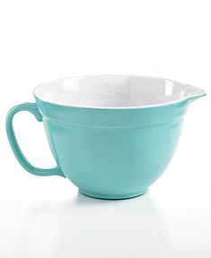 a teal colored bowl on a white background