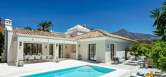 a house with a swimming pool in front of it