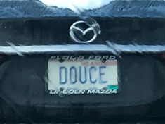 the back end of a car with a license plate that says douce on it