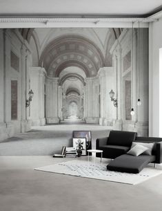 a living room with a couch, chair and large wall mural on the walls in black and white