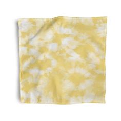 a yellow and white tie dye napkin on a white background with the word's name in