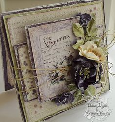 a close up of a card with flowers on it