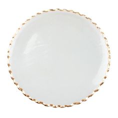 a white plate with gold trimmings on the rim and bottom, against a white background