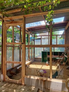 the inside of a chicken coop with lots of windows