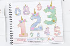 a spiral notebook with numbers and unicorns on it