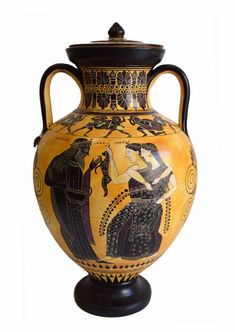 an old vase with black and yellow designs on it