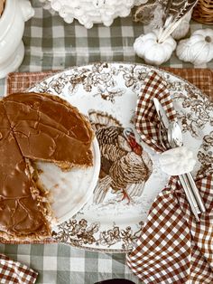 a plate with a piece of pie on it next to a fork and napkins