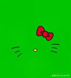 a green background with a cat's face and a red bow on its head