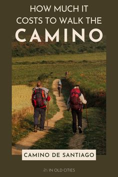 two people walking down a dirt road with the words how much it cost to walk the camino