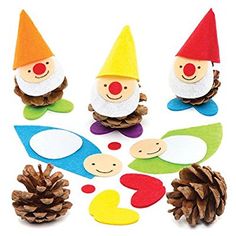 paper gnomes and pine cones on a white background