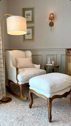 a white chair and ottoman in a room