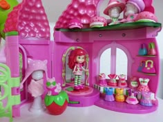 there is a doll house with lots of toys