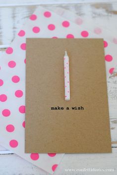 a notepad with a pen on it sitting next to a piece of paper that says make a wish