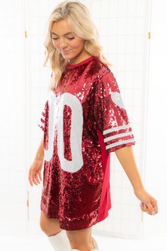 Calling all tailgate queens! We hope you have your party pact because you're going to want to have fun in our Garnet Sequin Jersey Dress! This stunning sequin dress is the perfect addition to your tailgate wardrobe! Featuring garnet sequins, short sleeves, and a mini hem, in this dress you're ready to party!Features: Garnet SequinsJersey graphicLined Boxy FitOne Size fits most Bust: 48in Length: 33in Red Summer Sequin Dress With Contrast Sequins, Red Contrast Sequin Dress For Summer, Red Short Sleeve Dresses With Sequins, Red Short Sleeve Sequined Dresses, Red Sequined Dress For Costume Party, Sequin Jersey Dress, Sequin Jersey, Gameday Dress, Jersey Dress