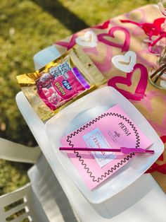 the table is set with candy and other items