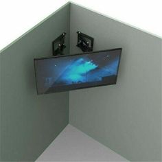 a television mounted to the side of a wall with two lights on it's sides