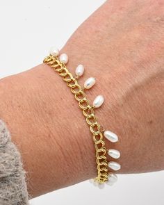 Sail away on the ocean of style with this gorgeous Lana Bracelet. This finely crafted, one-of-a-kind bracelet is made of 14 karat gold filled metal, making it highly durable and waterproof. Adorned with freshwater pearls, this piece will make a luxurious statement. It's a perfect gift to adorn any look and to remind you that you are one with the ocean, a goddess of the sea! #sculptressjewelry #shopsmall #womanowned #goldjewelry #jewelryaddict #jewelrylover Pearl Chain Bangle Bracelets, Pearl Bangle Bracelet With Pearl Chain, Dainty Gold Bracelets With Pearl Chain, Gold Plated Pearl Chain Bracelet As Gift, Gold Pearl Jewelry With Extender, Handmade Gold Pearl Bracelet, Handmade Gold Pearl Metal Bracelet, Adjustable Handmade Yellow Gold Pearl Bracelet, 14k Gold Filled Pearl Charm Bracelet