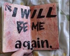 someone is holding an open book with writing on it that says, i will be me again