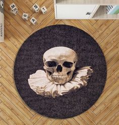 a round rug with a skull on it and dices around the area in front of it