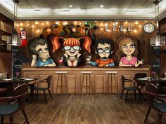 a restaurant with three cartoon characters on the wall and wood flooring in front of it