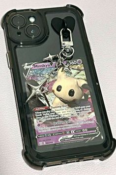 a cell phone case with a keychain attached to it's back cover