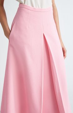 An inverted pleat at the front flaunts the crispness of Wickstead's tailoring skills on this midi skirt made from rosy, richly textured crepe. 32" length (size 18UK) Hidden back-zip closure Side-seam pockets Lined 95% polyester, 5% elastane Dry clean Made in the UK Designer Clothing Formal A-line Maxi Skirt With Pleated Waist, Cocktail A-line Skirt With Pleated Waist, Feminine Pink A-line Skirt, Feminine A-line Pleated Skirt, Formal A-line Bottoms With Box Pleat, Elegant A-line Maxi Skirt With Pleated Hem, Elegant Pink Pleated Skirt, Elegant Pink Evening Skirt, Elegant Pink Flared Dress