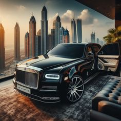 a black car parked in front of a city skyline