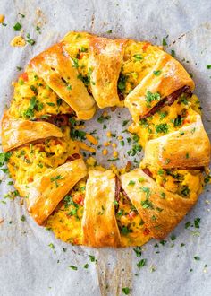 there is a pastry with cheese and herbs on it