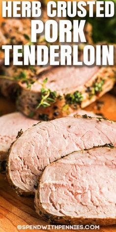 sliced pork tenderloin on a cutting board with parsley and herbs in the background