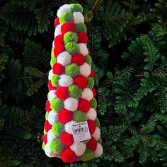 a christmas tree ornament made out of pom - poms